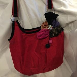 Red suede handbag